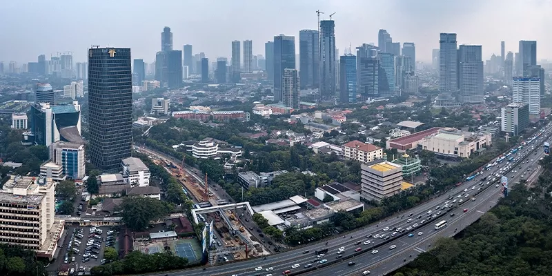 Skyline view of a central business district showing office towers, commercial buildings, and main roads in an Indian metro city