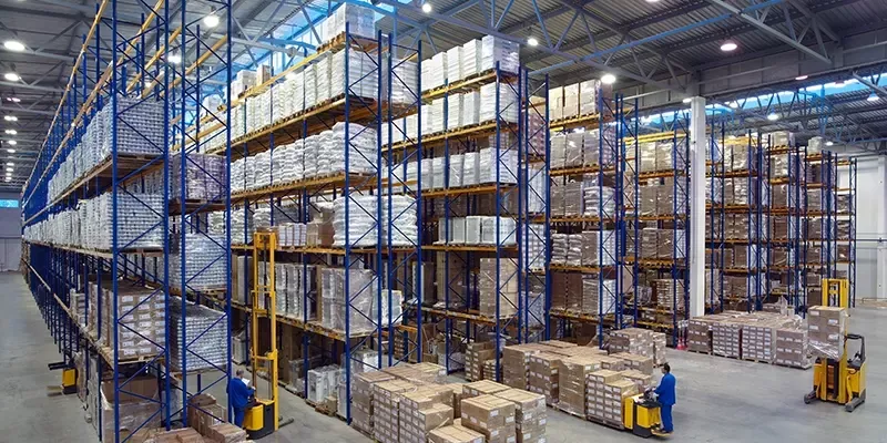 Modern private warehouse with high-rack storage system and palletized goods