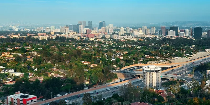 Aerial view of Hosa Road Bangalore showing residential neighborhoods, main road connectivity, and surrounding greenery